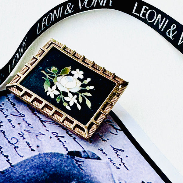 Leoni & Vonk Pietra Dura moutning locket on a vintage postcard with Leoni & Vonk ribbon