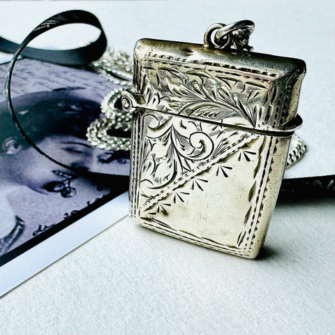 Leoni & Vonk 1917 vesta case neckalce on a sterling silver chain and with a vintage postcard and Leoni & Vonk ribbon