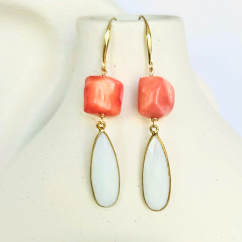 Leoni & Vonk coral and opalite earrings on a white vase