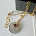 Leoni & Vonk vintage 1964 sixpence necklace on a white background