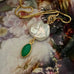 Leoni & Vonk green onyx and keshi pearl neckalce on a gold chain photographed on a floral image
