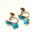 Leoni & Vonk 9ct rose gold and blue stone screw back earrings on a white background