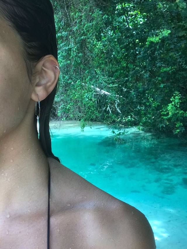Model in Jamaica wearing Leoni & Vonk sterling silver needle earring