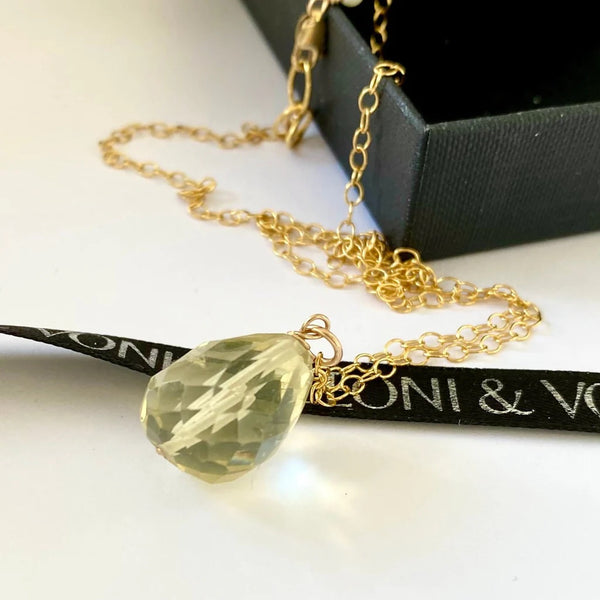 Leoni & Vonk citrine drop necklace on a white background with Leoni 7 Vonk ribbon