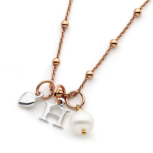 Image of Leoni & Vonk rose gold personalised necklace with pearl and heart drops photographed against a white background