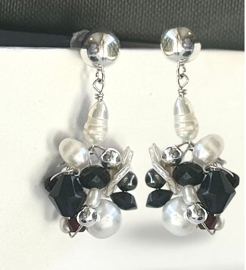 Leoni & Vonk silver cluster earrings on a white background and black box.