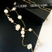 Leoni & Vonk long pearl and gold necklace on a black box