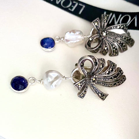 Leoni & Vonk sterling silver marcasite earrings with pearl and sapphire drops on a white background and with Leoni & Vonk ribbon.