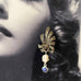 Leoni & Vonk sterling silver marcasite earrings with pearl and sapphire drops on an image of a vintage woman