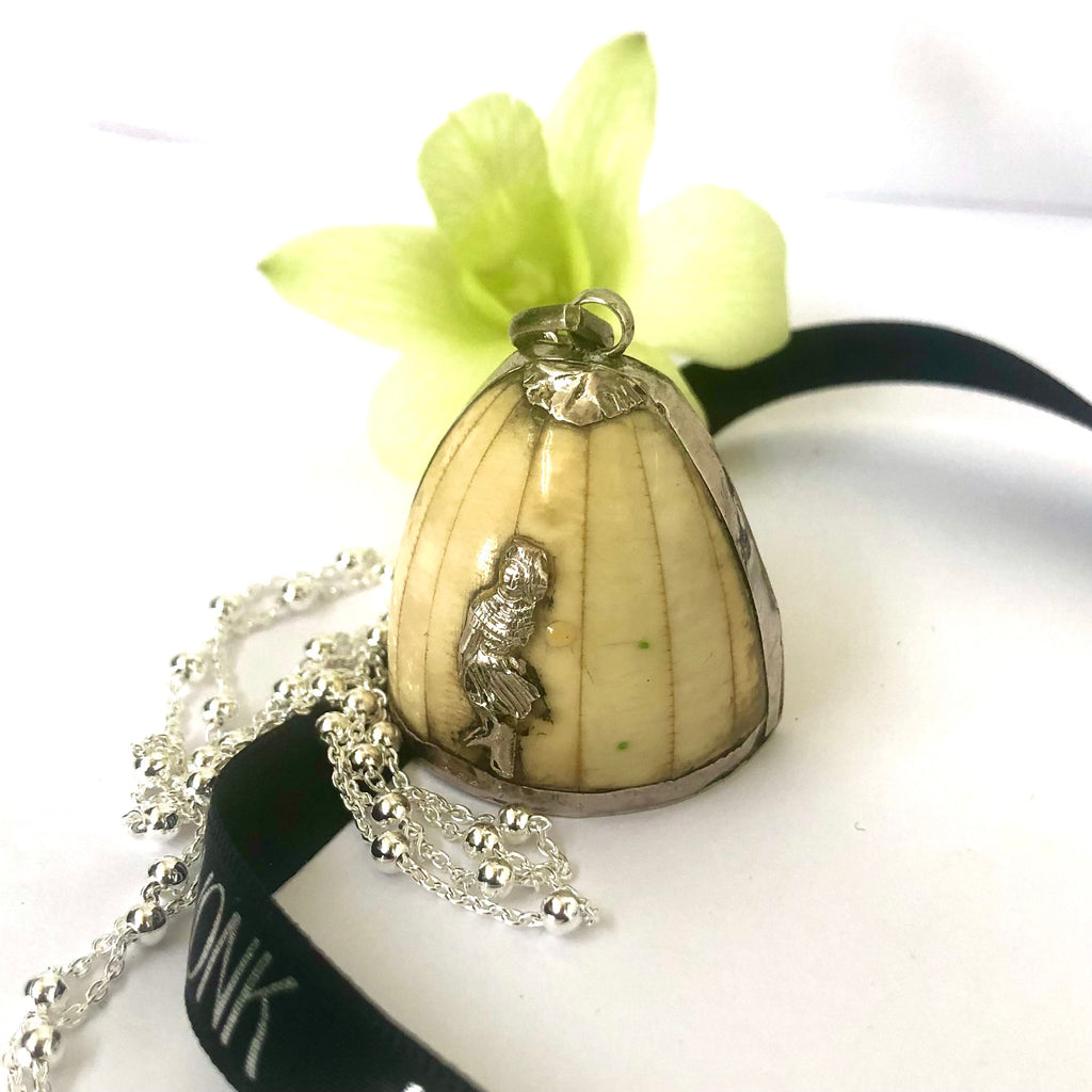 Leoni & Vonk silver and bone mid century pendant  necklace with black ribbon and a green flower.