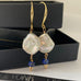 Leoni & vonk large keshi pearl and laspis earring on a black box and with Leoni & Vonk ribbon