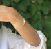 Model wearing Leoni & Vonk sterling silver and white pearl friendship bracelet.