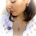 Dark haired model wearingLeoni & Vonk vintage micro mosaic earrings