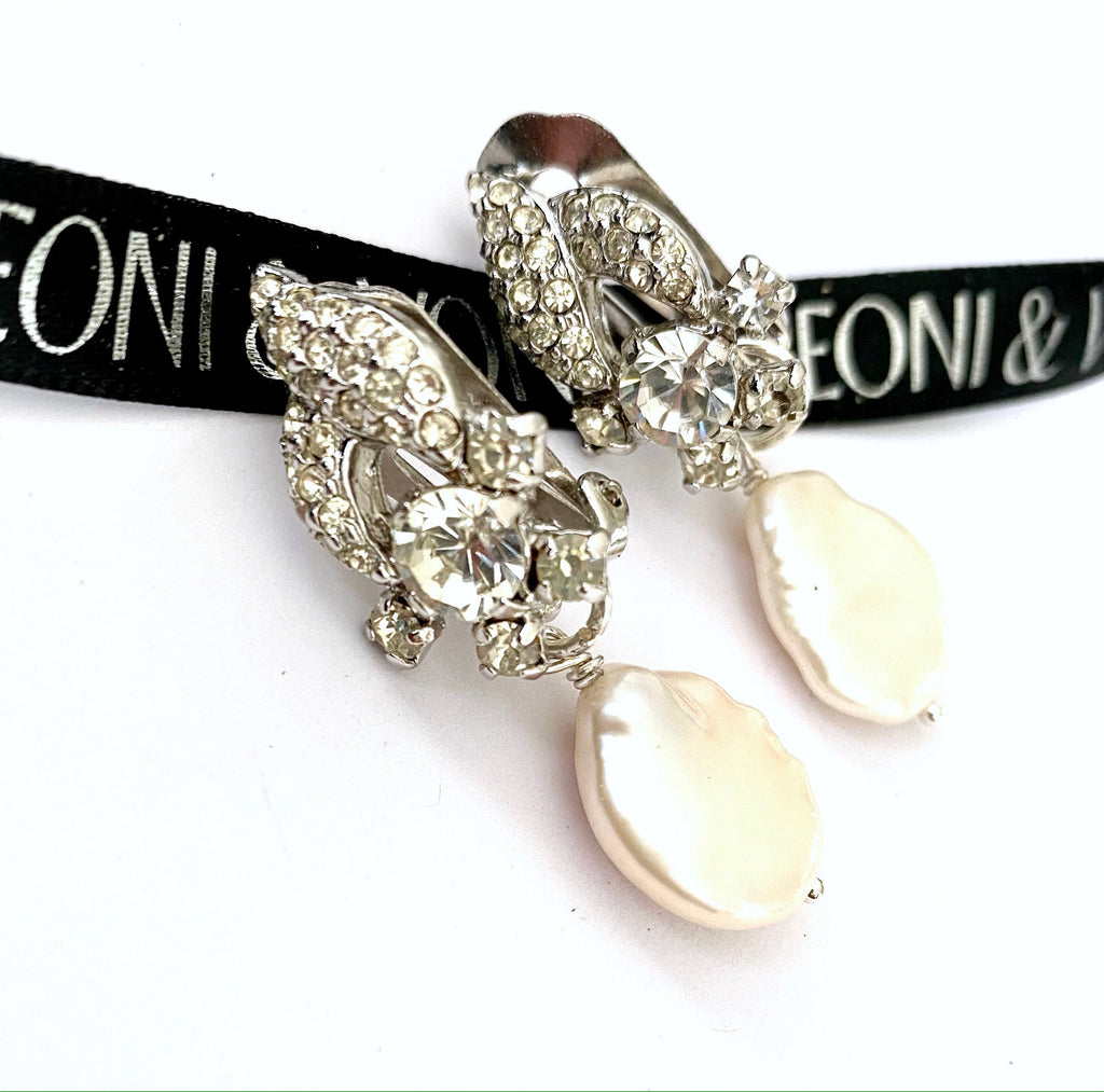Leoni & Vonk crystal and pearl earrings on a white background and with Leoni & Vonk ribbon