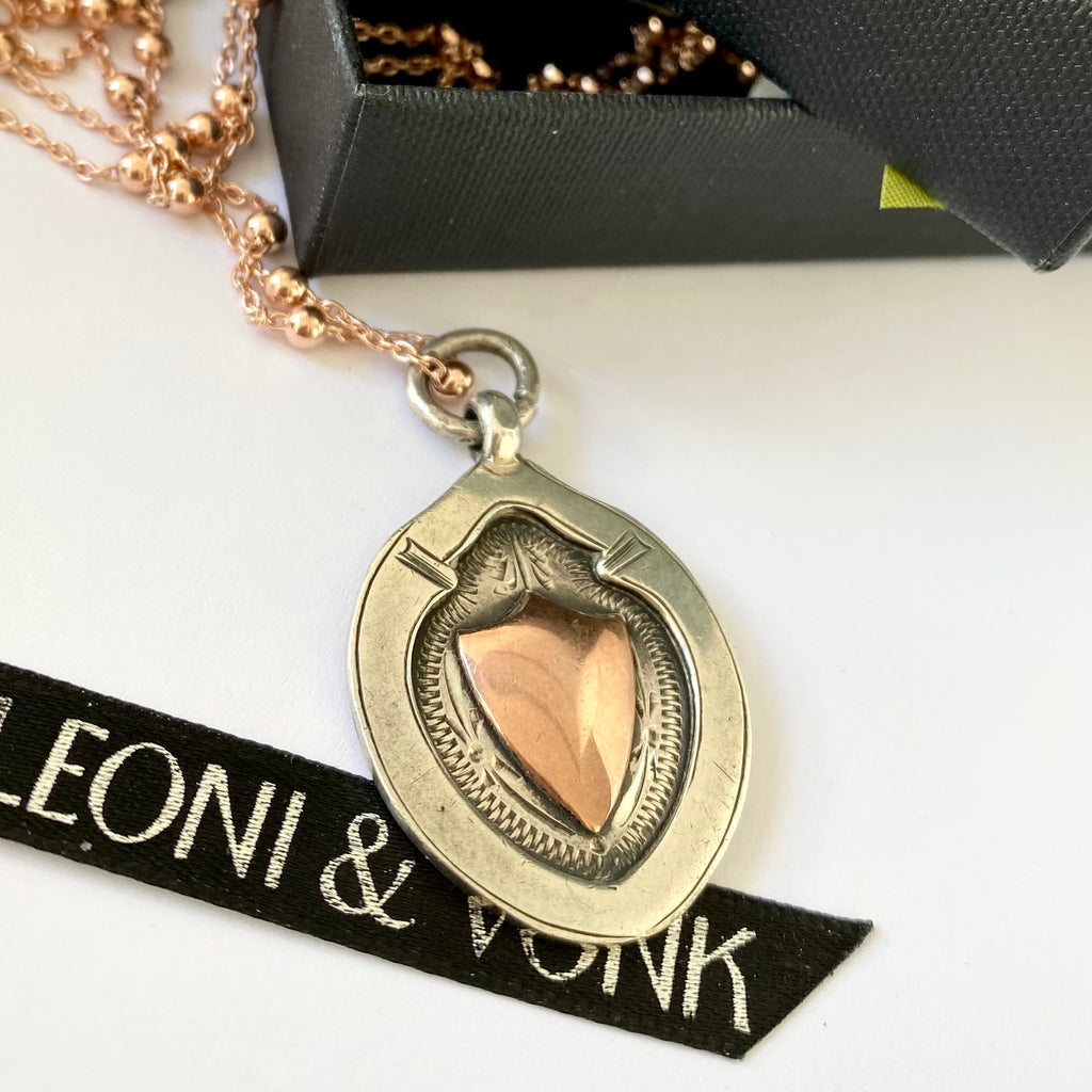 Leoni & Vonk 1931 sterling silver and rose quartz watch fob neckalce on a white background with Leoni & Vonk ribbon and a box