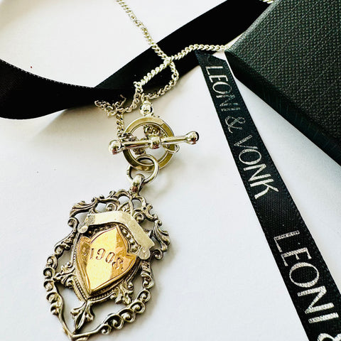 Leoni & Vonk William hair Hasler antique watch fob neckalce on a white background and with Leoni & Vonk ribbon