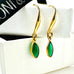 Leoni & Vonk May green onyx birthstone earrings on a white box and with Leoni & Vonk ribbon
