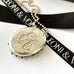 Leoni & Vonk victorian aesthetic locket on a white background with Leoni & Vonk ribbon