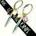 Leoni & Vonk interchangeable silver, amethyst and pearl earrings on a white background and with Leoni & Vonk ribbon