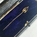 Leoni & Vonk antique wishbone stick pin with pearl in an antique box