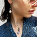 Dark haired girl wearing Leoni & Vonk jewellery and a blue kimono