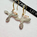 Leoni and Vonk sterling silver bee earrings on a white background and with Leoni & Vonk ribbon