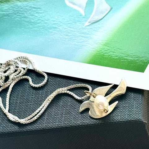 Leoni & Vonk sterling silver and pearl bird necklace with a Leoni & Vonk postcard