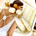 Leoni & Vonk bridal keshi pearl, moonstone gold stud earrings on a magazine page showing a bride