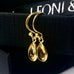 Leoni & Vonk natural citrine drop earrings on a black box and with Leoni & Vonk ribbon