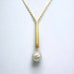 Leoni & Vonk Yi Su gold and pearl necklace on a white background