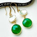 Leoni & Vonk keshi pearl and May birthstone green onyx earrings on a white box and with Leoni & Vonk ribbon