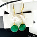Leoni & Vonk keshi pearl and May birthstone green onyx earrings on a white box and with Leoni & Vonk ribbon