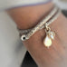 Leoni & Vonk leather snakeskin look bracelet on a woman's wrist