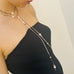 Cropped image of a girl wearing Leoni & Vonk silver leather and pearl wrap necklace