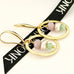 Leoni & Vonk gold and semi-precious stone and pearl drop on a white background and with Leoni & Vonk ribbon