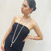 Dark haired girl wearing a black dress and Leoni & Vonk pearl jewellery