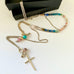 Leoni & Vonk long sterling silver and gemstone necklace with gemstones on a white background and with a Leoni & Vonk box