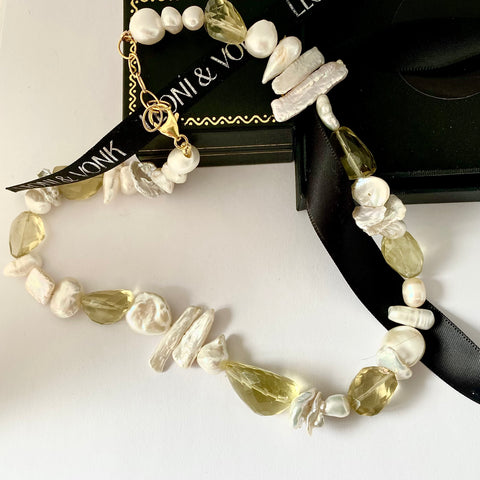 Leoni & Vonk pearl and citrine necklace on a white background and with Leoni & Vonk ribbon and box