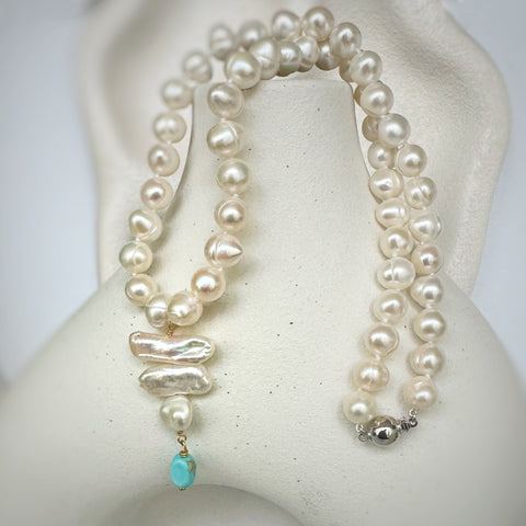 Leoni & Vonk pearl and howlite drop necklace on a white textured background