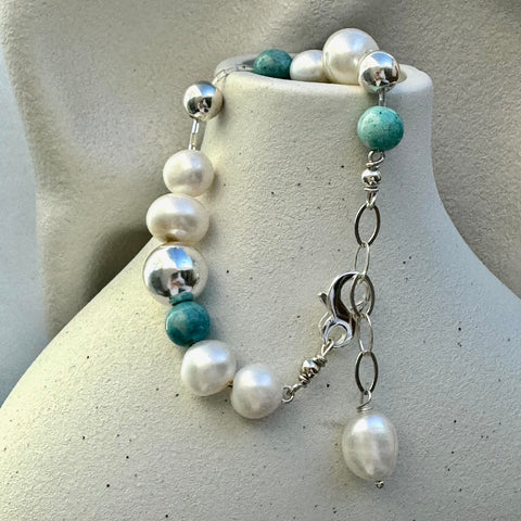 Leoni & Vonk pearl, howlite and sterling silver bracelet  hanging on a white vase