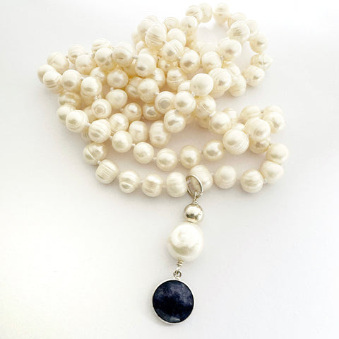 Leoni & Vonk long pearl necklace with sapphire and pearl drop on a white background