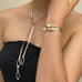 Cropped image of a girl wearing a black dress and Leon & Vonk leather and sterling silver chain necklace