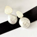 Leoni & Vonk yi Su silver and keshi pearl stud earrings on a white background with Leoni & Vonk ribbon