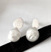 Leoni & Vonk yi Su silver and keshi pearl stud earrings on a white background with Leoni & Vonk ribbon
