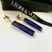 Leoni & Vonk sapphire and sterling silver stud earrings on a white background with Leoni & Vonk ribbon and a black box