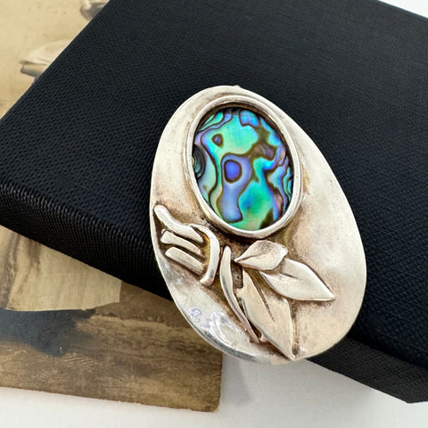 Leoni & Vonk sterling silver and abalone brooch on a black box