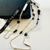 Leoni & Vonk sterling silver hematite and crystal necklace on a white background and with a Leoni & Vonk box and ribbon