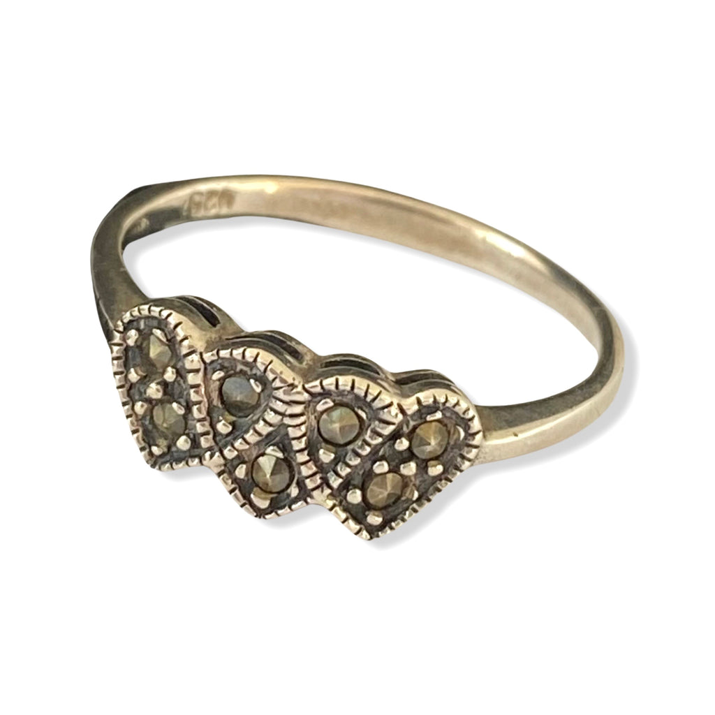 Leoni & Vonk vintage marcasite triple heart ring on a white background.