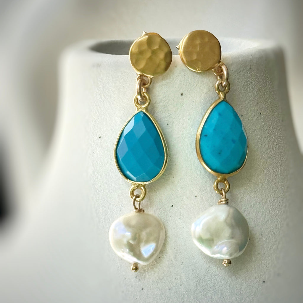 Leoni and Vonk turquoise and keshi pearl earrings on a white vase