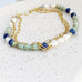 Leoni & Vonk turquoise and lapis bracelet on a speckled white background
